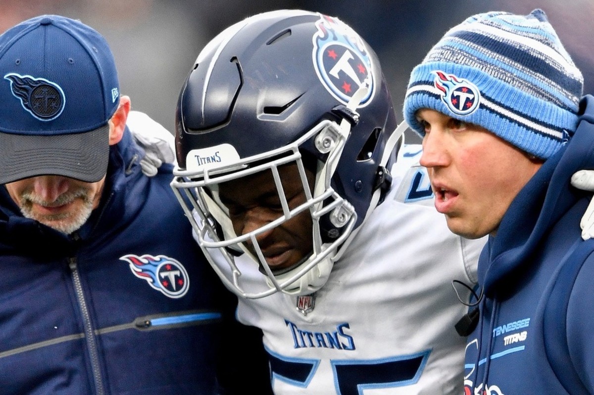 Tennessee Titans linebacker Monty Rice (56) is helped off the field during the second quarter at Gillette Stadium Sunday, Nov. 28, 2021 in Foxborough, Mass.